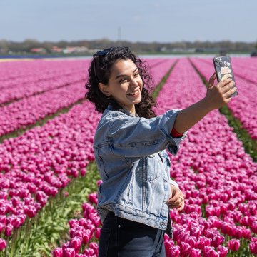 Selfie besides the tulips