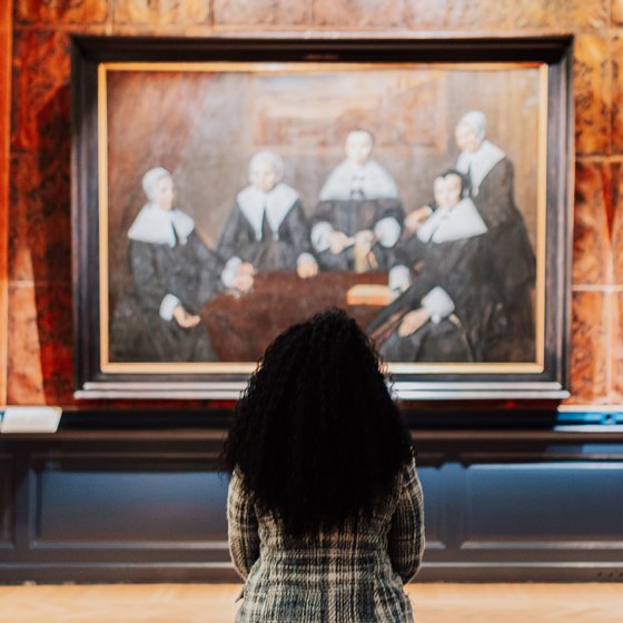 Lady views painting in Frans Hals Museum Haarlem