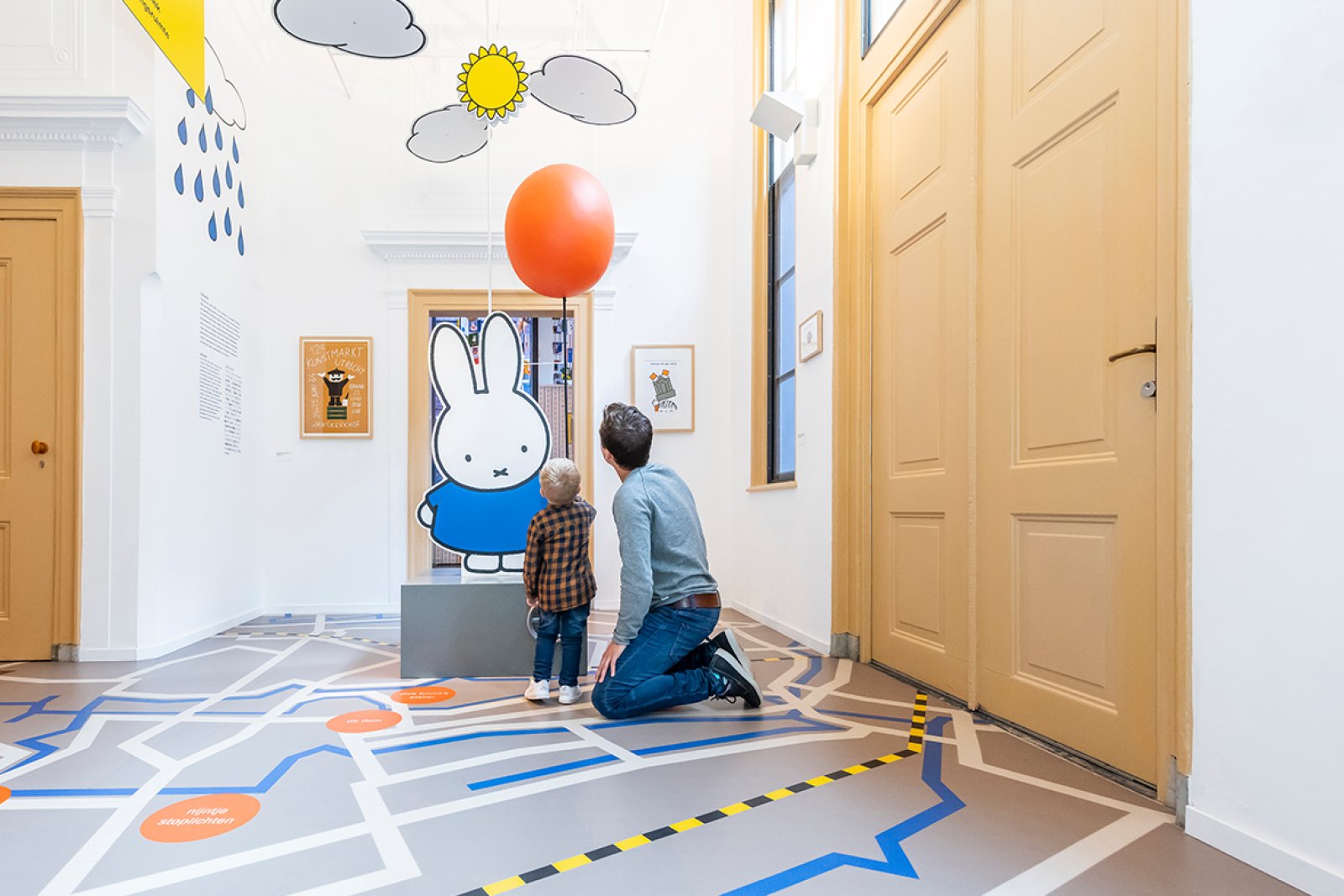 Father and child looking at Miffy in Miffy museum Utrecht