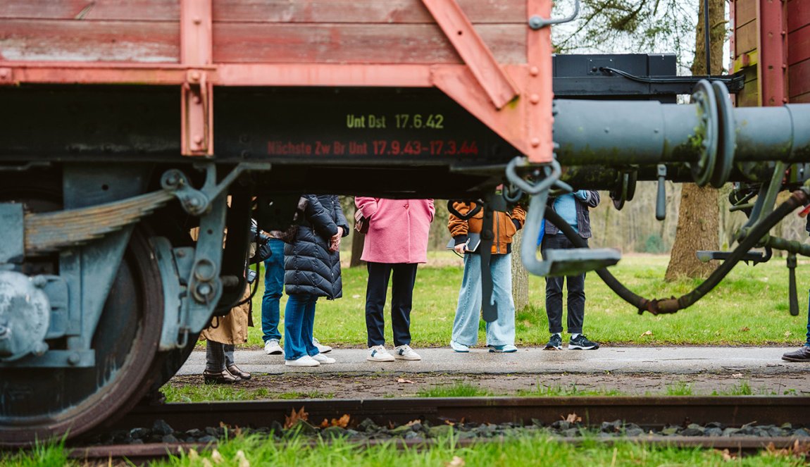 Visitors behind train at Kamp Westerbork Assen