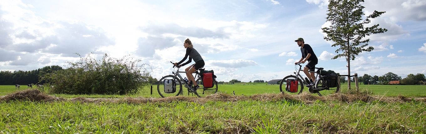 Couple on cycling vacation through the Netherlands