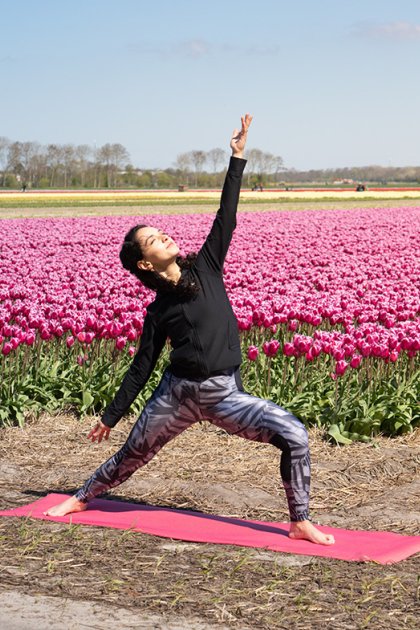 Yoga along the tulip field