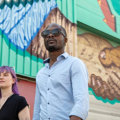 Couple in front of street art at the Keilewerf Rotterdam