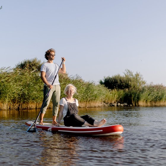 Couple supping on the Lauwersmeer