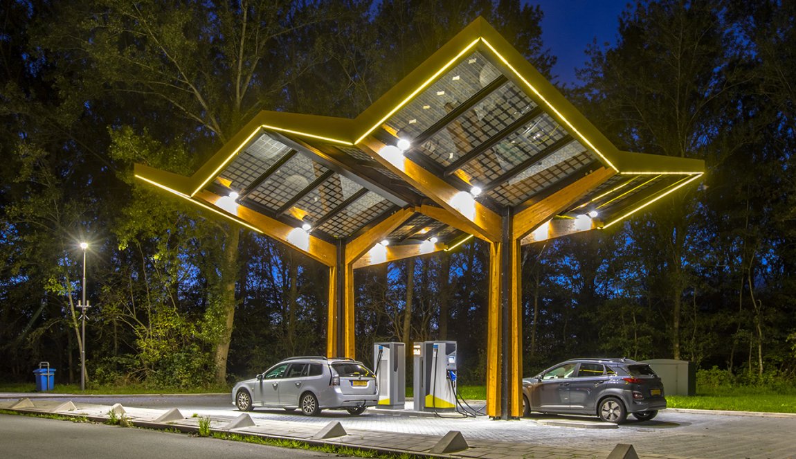 Electric cars charging at electricity filling station in the fast expanding car charging network in the Netherlands