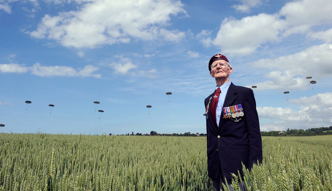 Veteran looking at parachutists