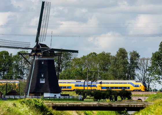 NS train through landscape with mill NS train through landscape with mill