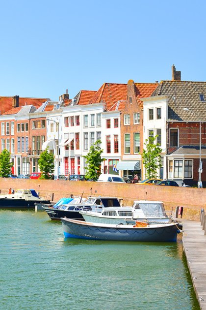 View of Middelburg with beautiful houses and boats along the canal.