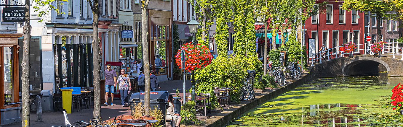 Delft city centre with canal and bikes Delft city centre with canal and bikes