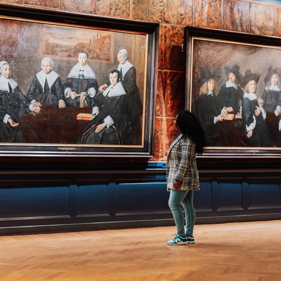 Lady looks at paintings in Haarlem Frans Hals Museum 