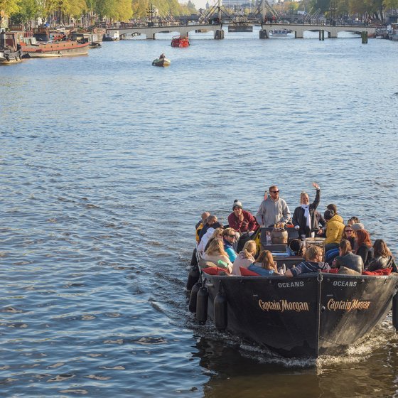 Group of visitors at canal open boat excursion