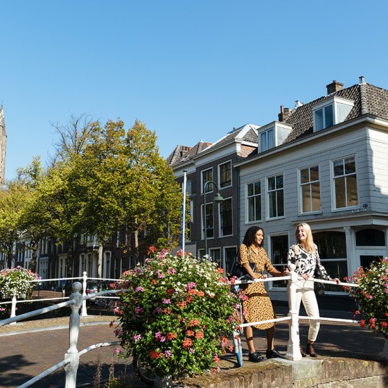Ladies look out over Delft canal