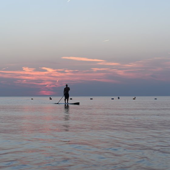 Active relaxation in Noordwijk: stand-up paddleboarding in the ocean