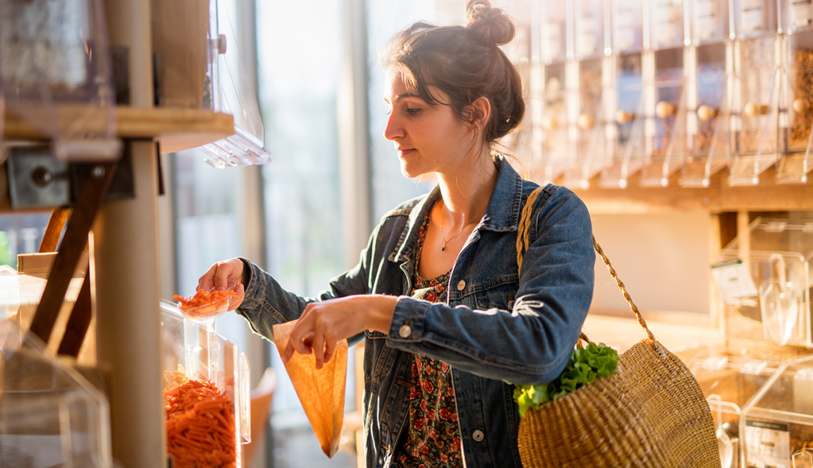 Young woman shopping in a bulk store 