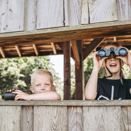 Children with binoculars in Kropswolderbuitenpolder Bird watching hut