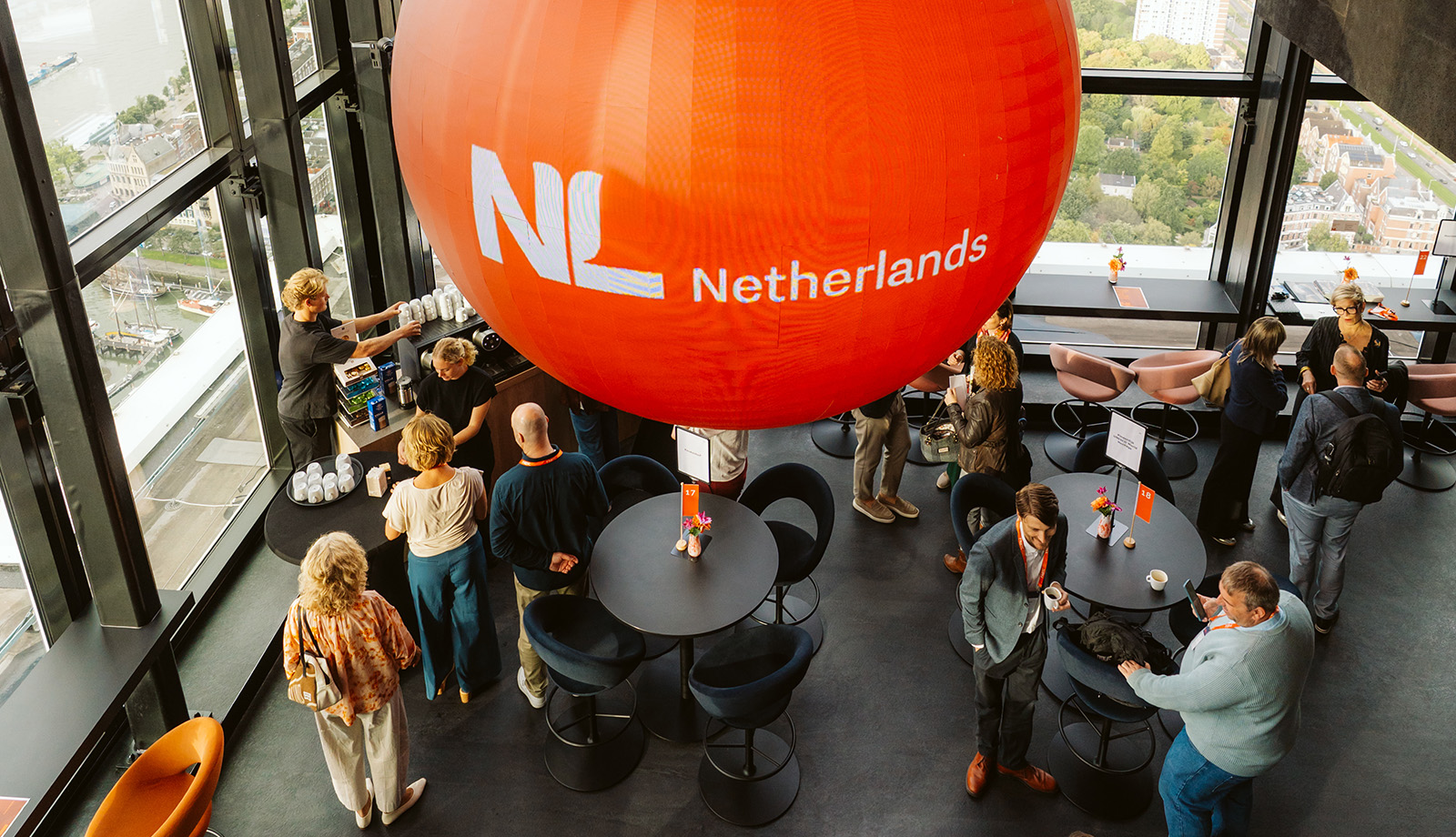 Participants at the Travel Trade Networking Event beneath the Netherlands branding in Rotterdam