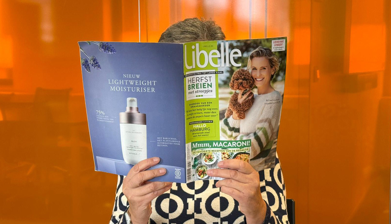 Belgium press colleague reading magazine