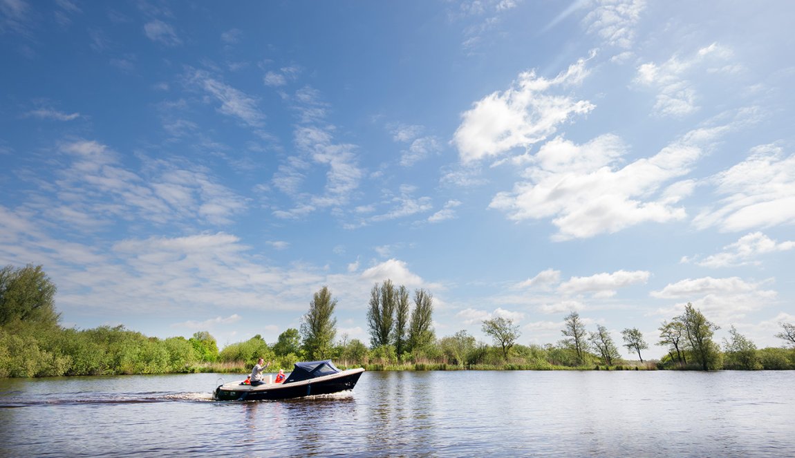 Sloop sailing over the waters in Friesland Sloop sailing over the waters in Friesland