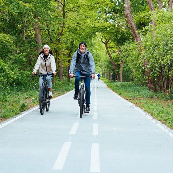 Cyclists on smooth wide bike path
