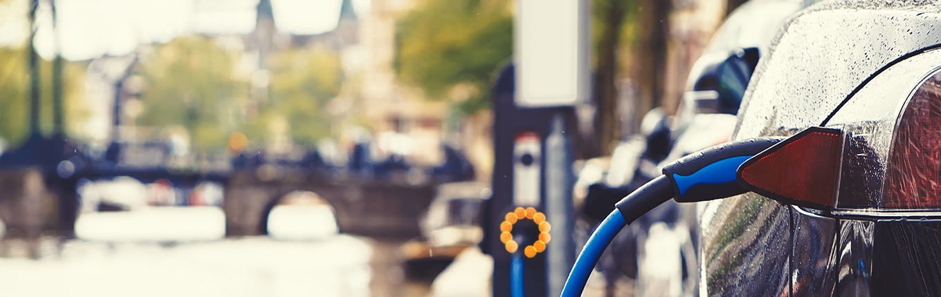 Electric car charging in the street of Amsterdam Electric car charging in the street of Amsterdam