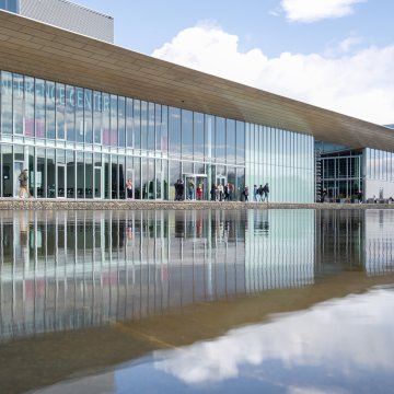 Conference Center at High Tech Campus Eindhoven with visitors outside the entrance