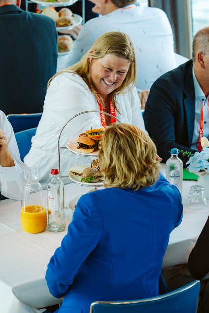 Travel Trade Networking Event participants networking over lunch during a boat trip in Rotterdam.