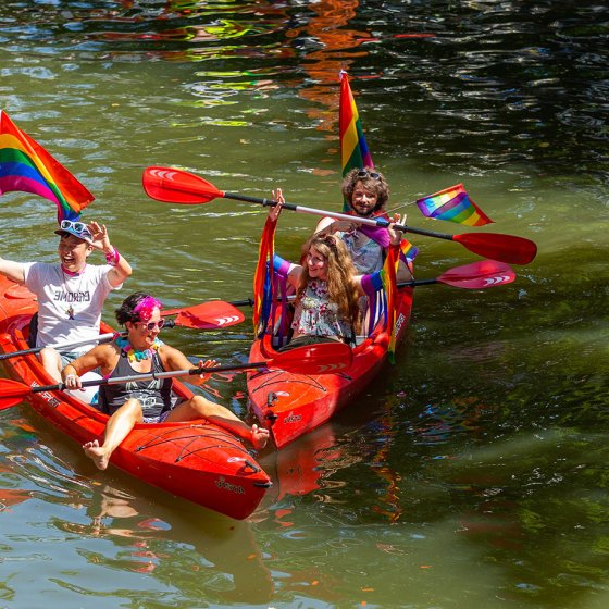 Pride Amsterdam boat filled with revellers during the Canal Parade on Amsterdam&rsquo;s canals