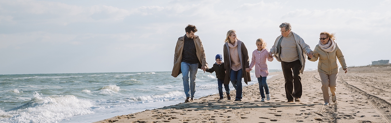 Family walking on the beach with grandparents Family walking on the beach with grandparents