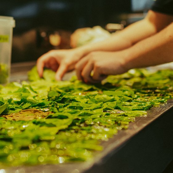 In the kitchen of The New Shop with green leaves