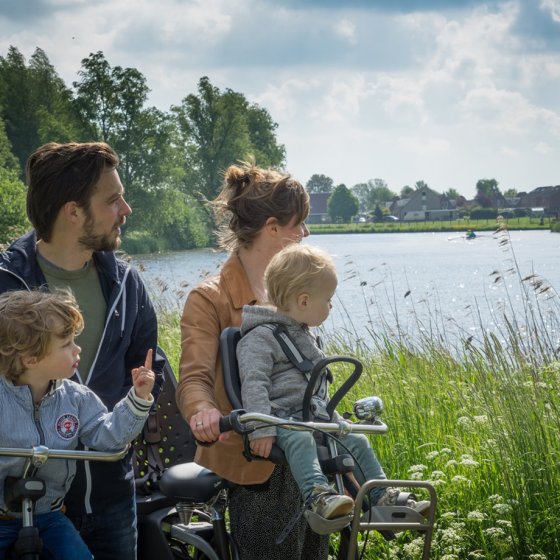 Cycling with the family along the water in Friesland