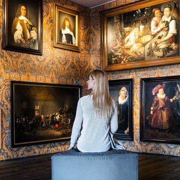 Lady on bench in Westfries museum in Hoorn