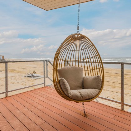 Hanging chair on the terrace of a Zeezigt beach house overlooking the North Sea in Petten, the Netherlands