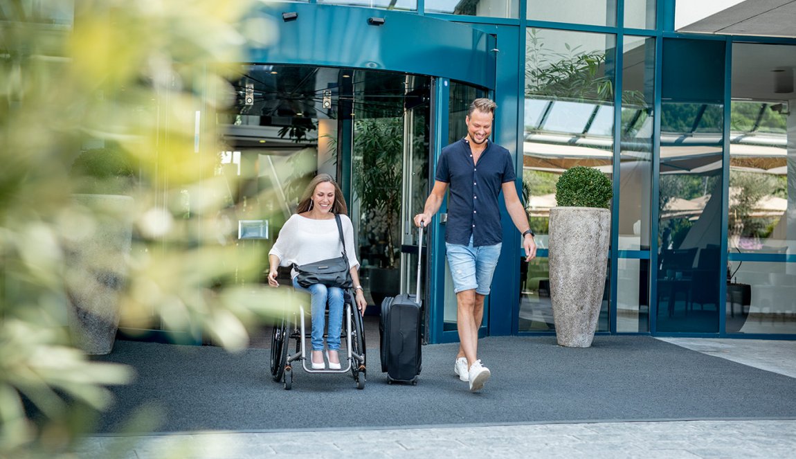 Couple after visiting Sanadome Hotel & Spa Nijmegen. Lady is in a wheelchair.