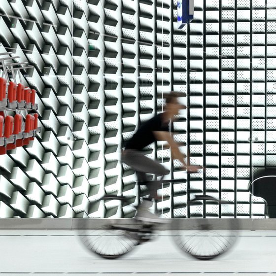 Cyclist bike through bike parking lot The Hague Koningin Julianaplein designed bij Silo